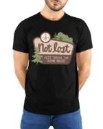Not Lost Scenic Route Tshirt Funny Travel Adventure Graphic - model wearing black tee with hands behind back