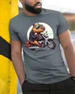 Capybara Riding Motorcycle Tee Cute Biker Humor Graphic - model wearing grey tee, leaning on column