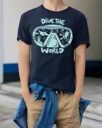 Dive The World Scuba Diving Graphic Tshirt Ocean Adventure Style - model wearing navy tee with hands in pockets
