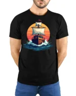 Vintage Sailing Ship Sunset Ocean Graphic Tshirt Adventure Style - model wearing black tee with hands behind back