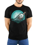 Ocean Message Bottle Ship Graphic Tshirt Calm Sea Adventure Style - model wearing black tee with hands behind back