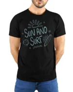 Sun And Surf Beach Graphic Tshirt Relaxed Summer Ocean Vibes Style - model wearing black tee with hands behind back