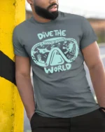 Dive The World Scuba Diving Graphic Tshirt Ocean Adventure Style - model wearing grey tee, leaning on column