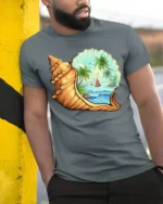 Tropical Ocean Shell Beach Graphic Tshirt Coastal Paradise Style - model wearing grey tee, leaning on column