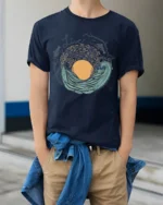 Live Wild Ocean Wave Nature Adventure Artistic Graphic Tee - model wearing navy tee with hands in pockets