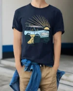 Surf Truck Sunset Dog Beach Adventure Retro Graphic Tee - model wearing navy tee with hands in pockets