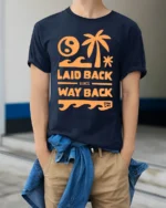 Laid Back Since Way Back Retro Beach Chill Vibes Graphic Tee - model wearing navy tee with hands in pockets