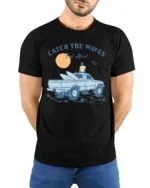 Catch The Waves Surf Truck Beach Adventure Vintage Graphic Tee - model wearing black tee with hands behind back