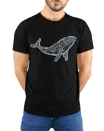 Artistic Tribal Whale Ocean Nature Inspired Graphic Tee - model wearing black tee with hands behind back