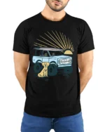 Surf Truck Sunset Dog Beach Adventure Retro Graphic Tee - model wearing black tee with hands behind back