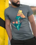 Geometric Mountain Waterfall Nature Adventure Graphic Tee - model wearing grey tee, leaning on column