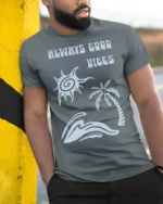 Always Good Vibes Retro Beach Wave Positive Graphic Tee - model wearing grey tee, leaning on column