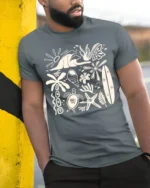 Retro Beach Icons Ocean Summer Coastal Graphic Tee - model wearing grey tee, leaning on column