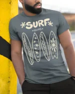 Surf Club Retro Surfboards Beach Lifestyle Graphic Tee - model wearing grey tee, leaning on column