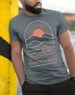 Keep It Simple Retro Sunset Van Life Minimalist Graphic Tee - model wearing grey tee, leaning on column