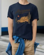Arizona Desert Sunset Vintage Western Landscape Graphic Tee Tshirt - model wearing navy tee with hands in pockets