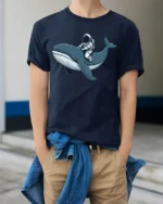 Astronaut Riding Whale Space Ocean Adventure Graphic Tee Tshirt - model wearing navy tee with hands in pockets