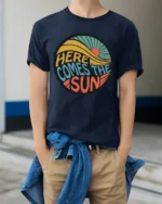 Here Comes The Sun Retro Vintage Sunshine Graphic Tee Tshirt - model wearing navy tee with hands in pockets