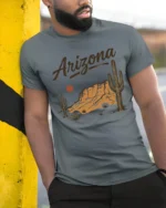 Arizona Desert Sunset Vintage Western Landscape Graphic Tee Tshirt - model wearing grey tee, leaning on column