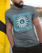 You Cant Stop The Waves But You Can Surf Them Graphic Tee Tshirt - model wearing grey tee, leaning on column