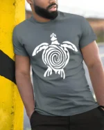 Tribal Sea Turtle Ocean Animal Symbol Graphic Tee Tshirt - model wearing grey tee, leaning on column