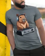 Funny DJ Capybara Music Lover Animal Graphic Tee Tshirt - model wearing grey tee, leaning on column