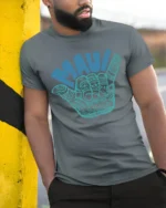 Maui Shaka Hand Hawaiian Surf Culture Graphic Tee Tshirt - model wearing grey tee, leaning on column