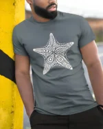 Boho Starfish Ocean Mandala Beach Aesthetic Graphic Tee Tshirt - model wearing grey tee, leaning on column