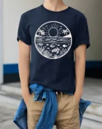 Ocean Sunset Marine Life Graphic Tee Coastal Nature Style - model wearing navy tee with hands in pockets