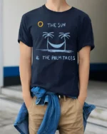 The Sun And Palm Trees Relax Graphic Tee Beach Chill Style - model wearing navy tee with hands in pockets