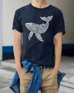 Tribal Whale Ocean Graphic Tee Artistic Marine Life Style - model wearing navy tee with hands in pockets