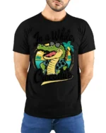 In A While Crocodile Funny Vacation Graphic Tee Beach Humor - model wearing black tee with hands behind back