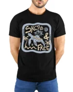Salty And Free Sea Turtle Graphic Tee Beach Life Style - model wearing black tee with hands behind back