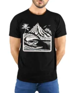 Surfing Iguana Mountain Wave Graphic Tee Tropical Adventure - model wearing black tee with hands behind back