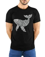 Tribal Whale Ocean Graphic Tee Artistic Marine Life Style - model wearing black tee with hands behind back
