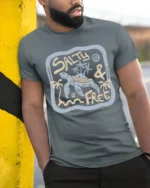 Salty And Free Sea Turtle Graphic Tee Beach Life Style - model wearing grey tee, leaning on column