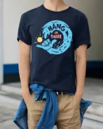 Hang In There Motivational Wave Graphic Tee Positive Style - model wearing navy tee with hands in pockets