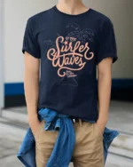 Surfer Waves Retro Beach Graphic Tee Ocean Lifestyle Style - model wearing navy tee with hands in pockets