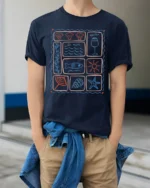 La Mer Coastal Icons Graphic Tee Ocean Vacation Style - model wearing navy tee with hands in pockets