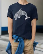 Tribal Dolphin Graphic Tee Ocean Spirit Artistic Style - model wearing navy tee with hands in pockets
