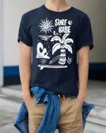 Surf Babe Graphic Tee Retro Beach Vibes Coastal Style - model wearing navy tee with hands in pockets