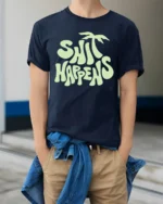 Funny Shit Happens Graphic Tshirt Retro Humor Vibes Style - model wearing navy tee with hands in pockets
