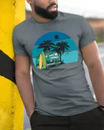 Vintage Surf Van Beach Sunset Graphic Tee Retro Summer Style - model wearing grey tee, leaning on column
