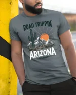 Arizona Desert Road Trip Graphic Tee Retro Travel Adventure Style - model wearing grey tee, leaning on column