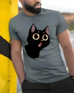 Cute Black Cat Big Eyes Graphic Tee Funny Cartoon Style - model wearing grey tee, leaning on column