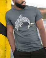 Tribal Dolphin Graphic Tee Ocean Spirit Artistic Style - model wearing grey tee, leaning on column