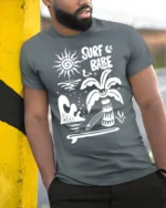 Surf Babe Graphic Tee Retro Beach Vibes Coastal Style - model wearing grey tee, leaning on column