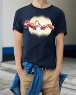 Funny Creation Of Adam Coffee Graphic Tee Art Parody Style - model wearing navy tee with hands in pockets