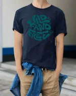 Wild And Free Retro Typography Graphic Tee Adventure Vibes - model wearing navy tee with hands in pockets