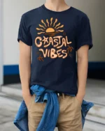 Coastal Vibes Retro Sunset Graphic Tee Beach Aesthetic Style - model wearing navy tee with hands in pockets